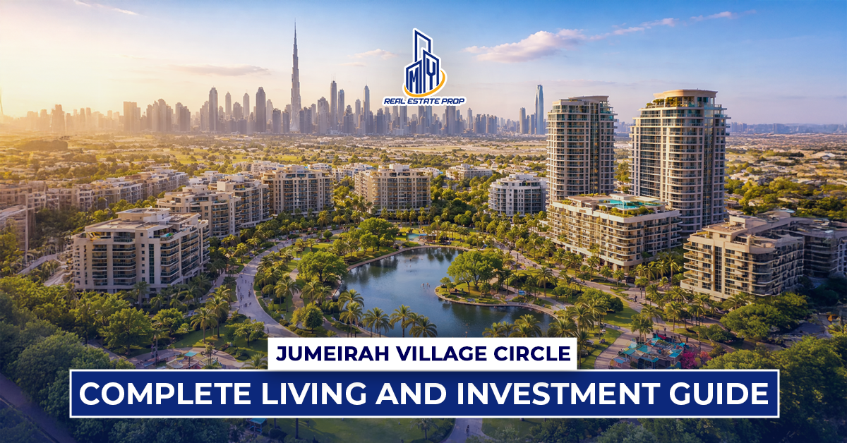 Aerial view of Jumeirah Village Circle real estate with modern apartments, green parks, and Dubai skyline in background